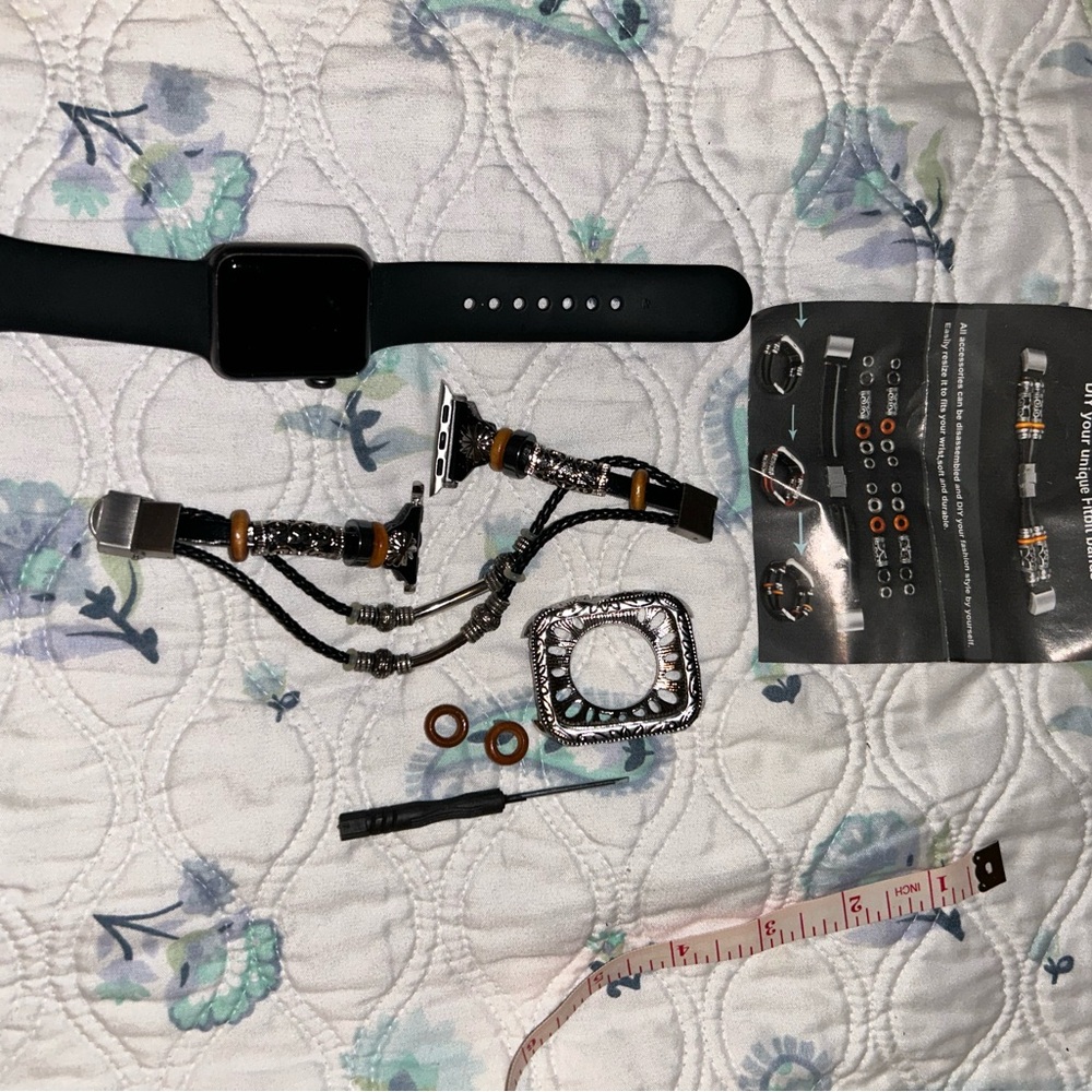 Apple Watch with black band and dressy beaded with silver hardware